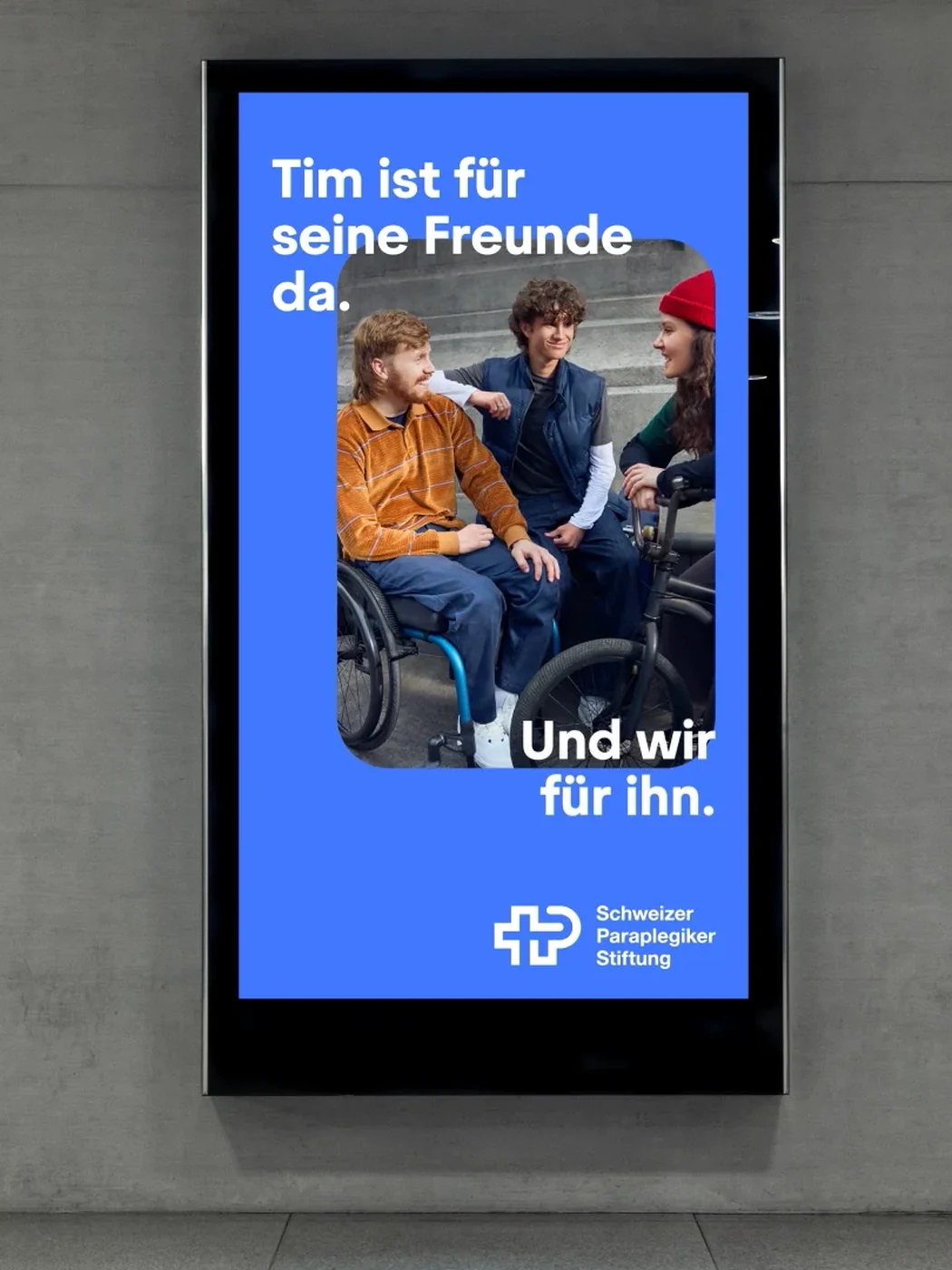The campaign running as a digital out of home poster in a station